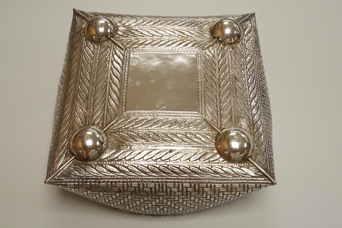 An Indian or Middle Eastern white metal fruit bowl, with 'basket weave' decoration, indistinct marks, diameter 21.8cm, 10.2oz.